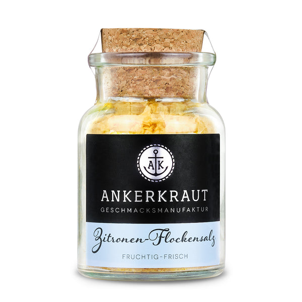 Flockensalz von Ankerkraut im Korkenglas auf weißem Hintergrund.